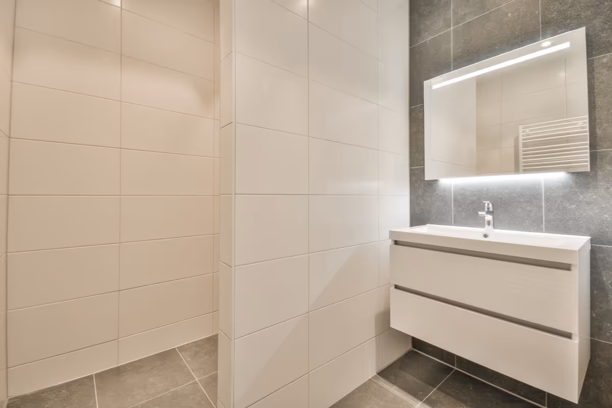 bathroom with a half wall shower partition