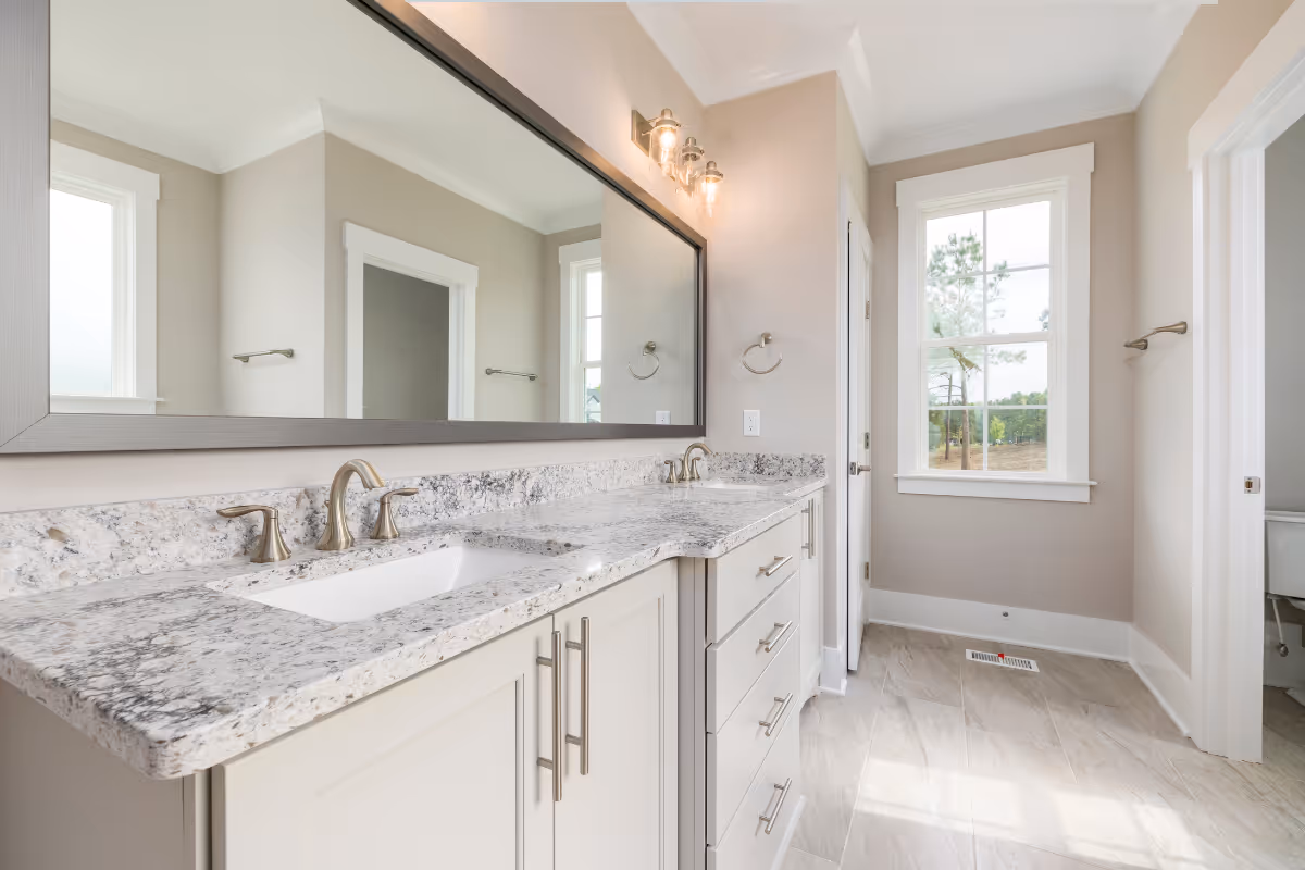 bathroom with marble countertops