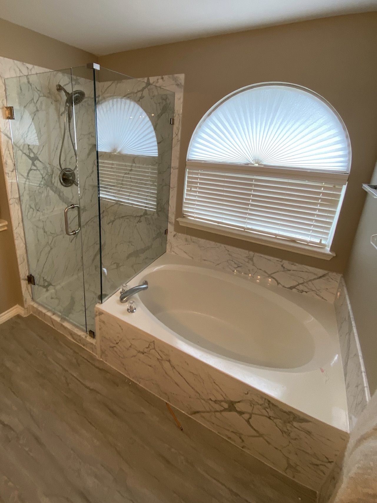 light-filled coastal bathroom with big circular window