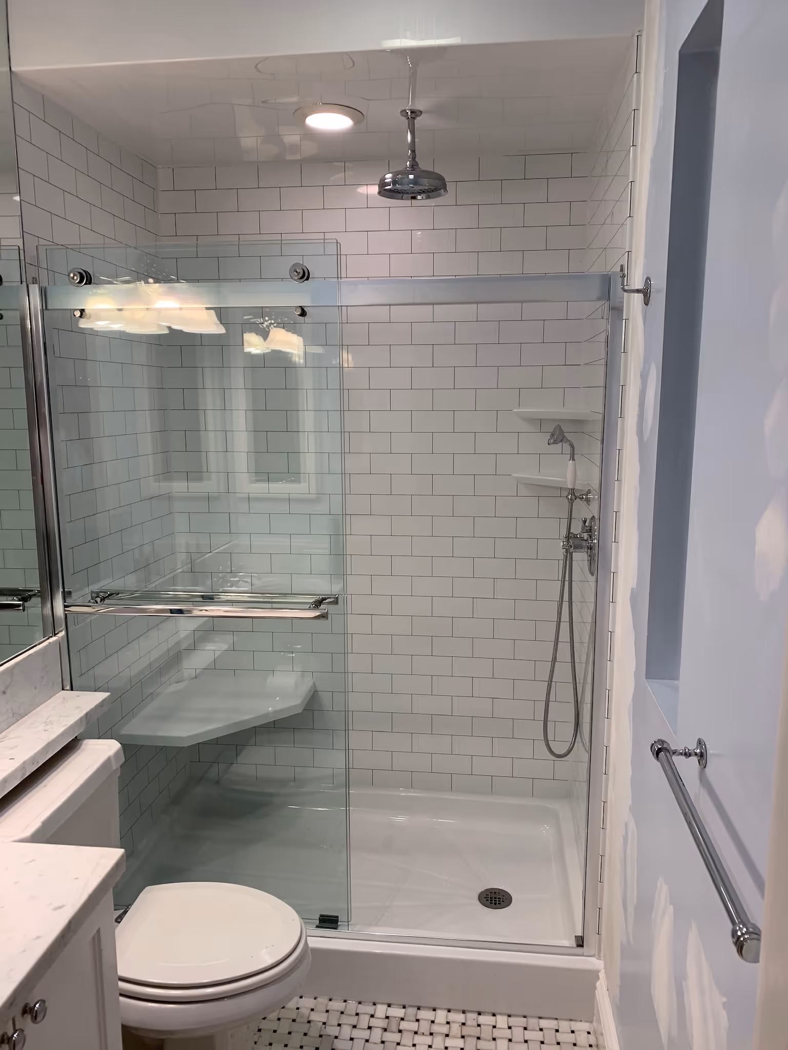 industrial bathroom with overhead 