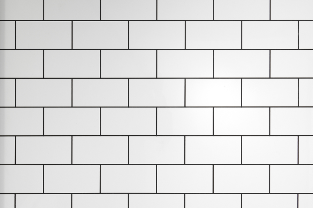 white subway shower tile with black grout lines
