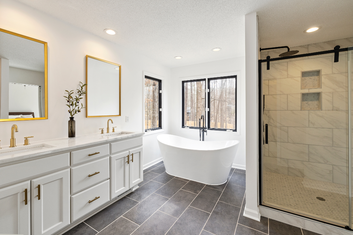 spa-like minimalist main bathroom design with freestanding tub and walk-in rainfall shower