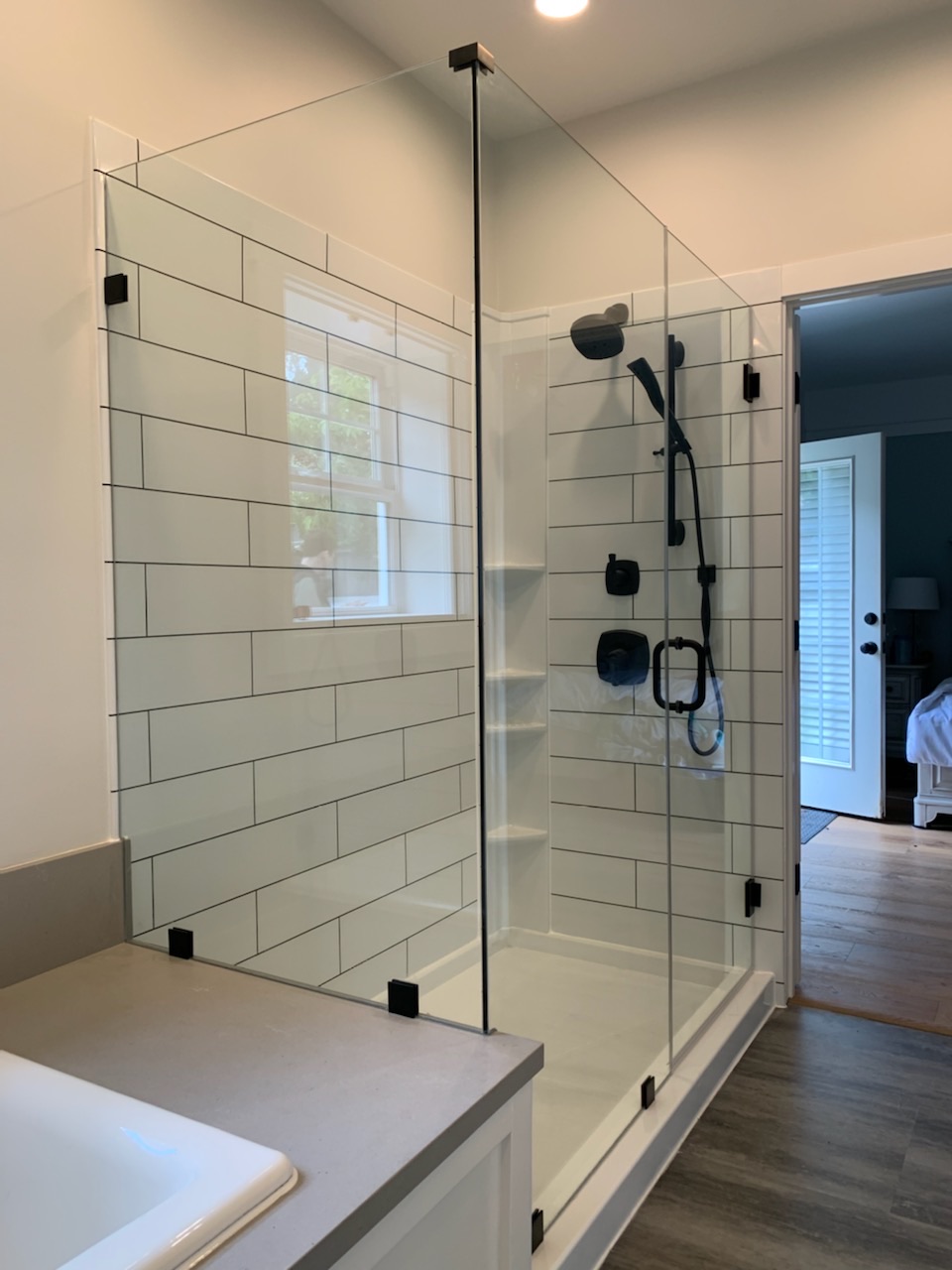 walk-in corner shower with glass enclosure 