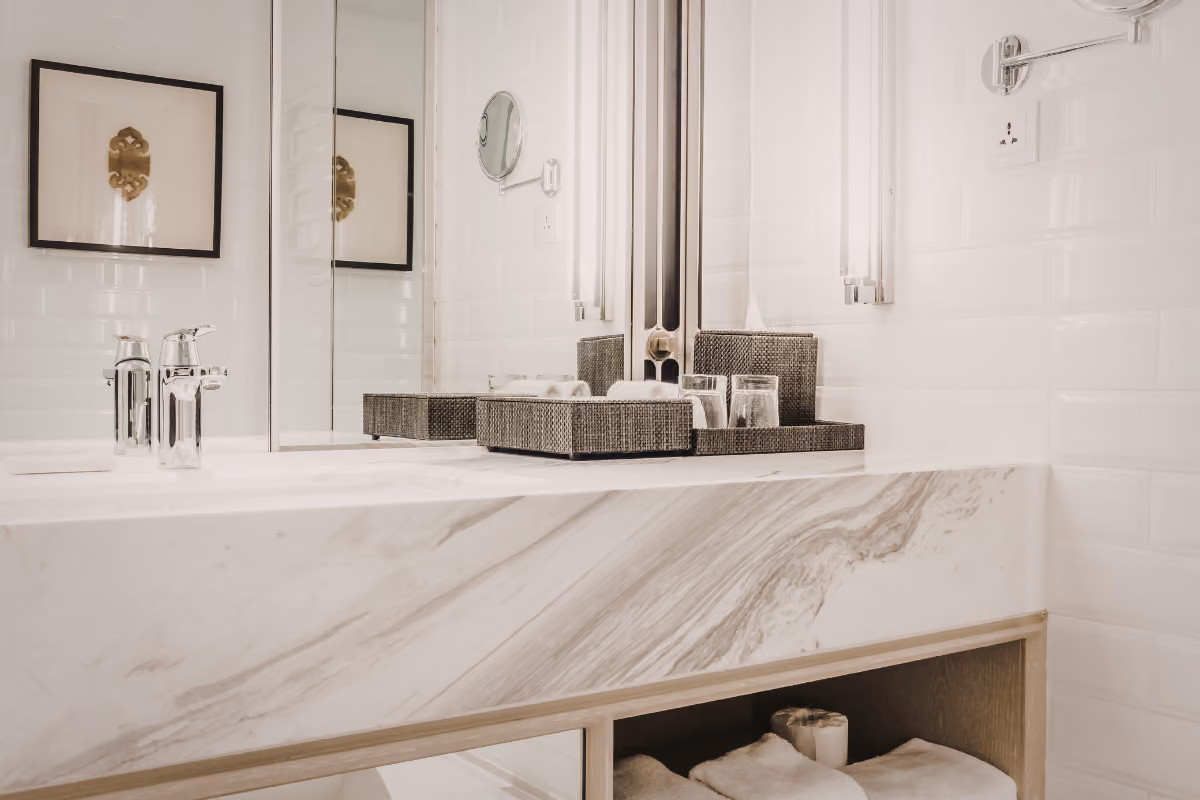 bathroom with white marble vanity