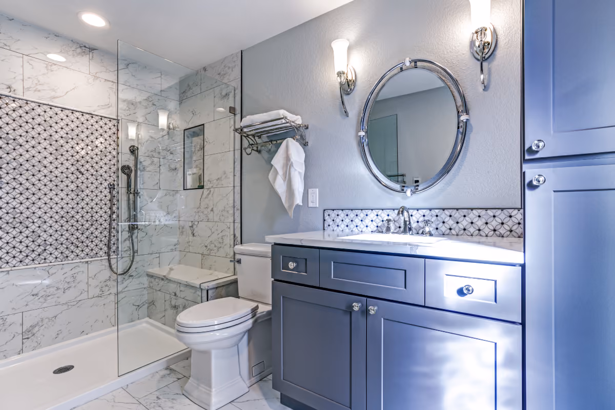 bathroom with blue bathroom vanity and mosaic backsplash