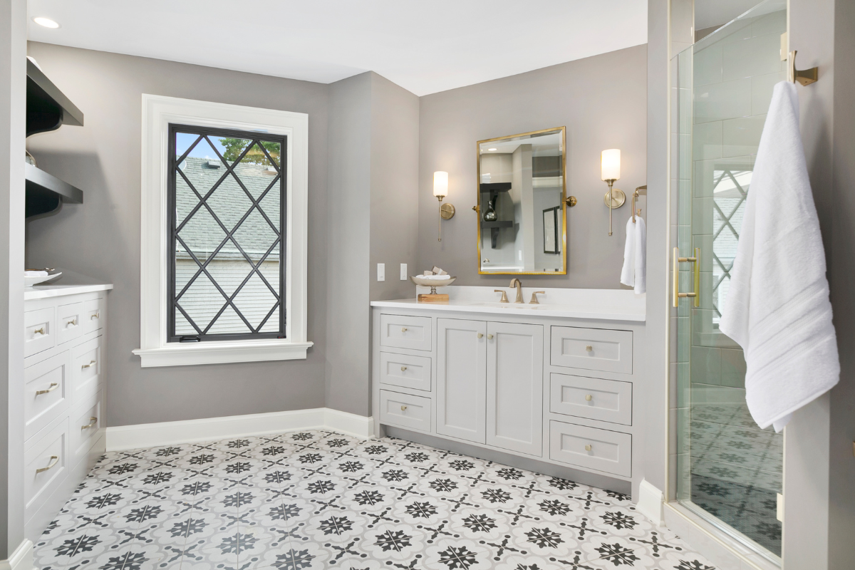 main bathroom lighting with sconces on both sides of white vanity