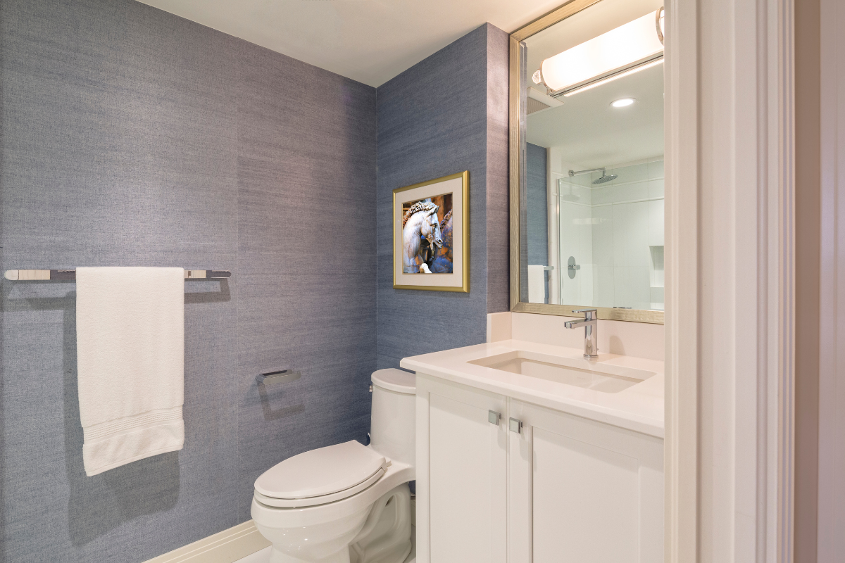 three-quarter bathroom with light bar above mirror for bathroom lighting