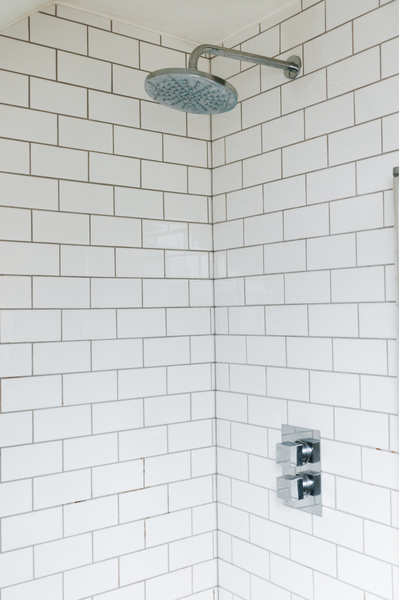 shower with traditional tile shower wall