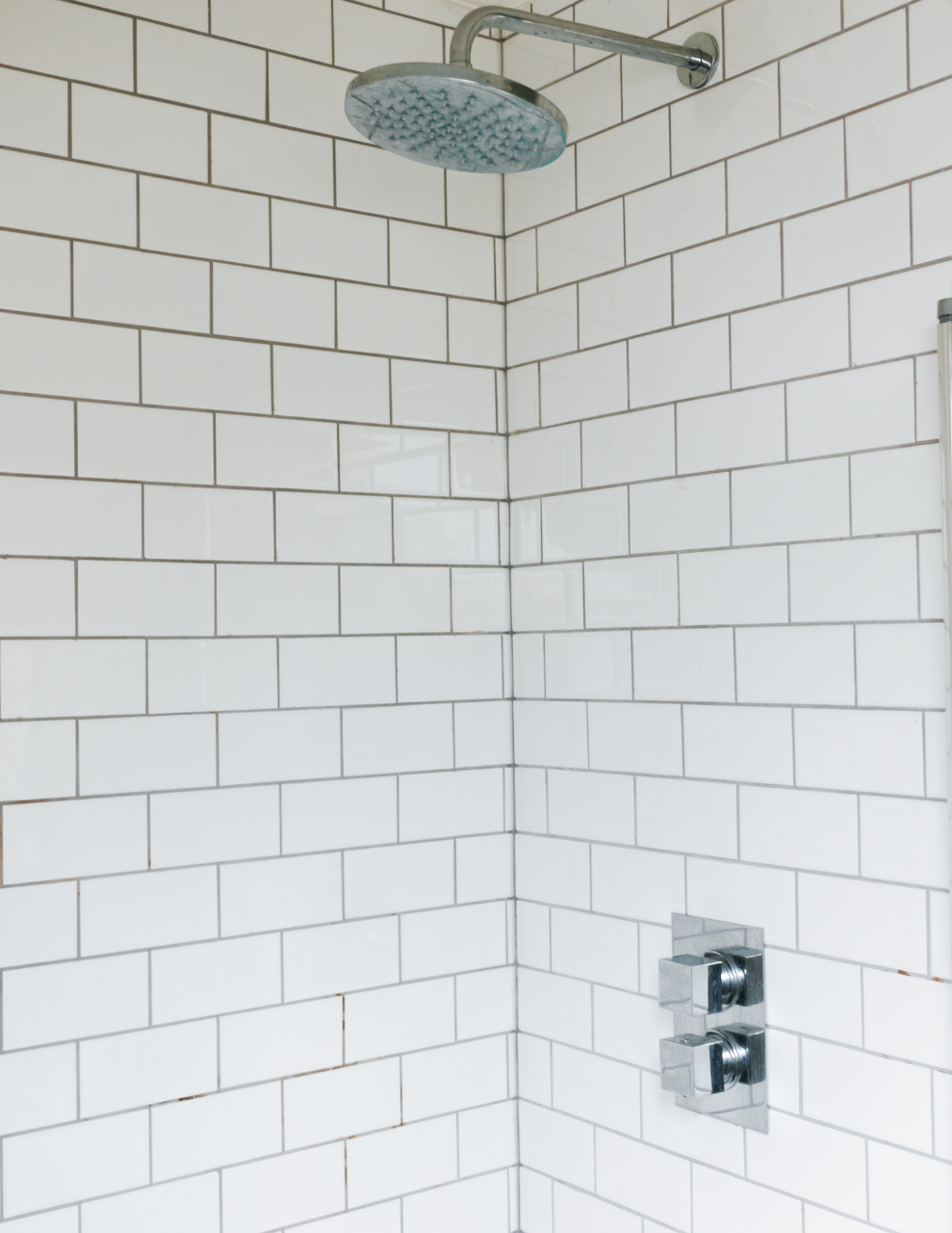 shower with subway tiles in ceramic shower wall material