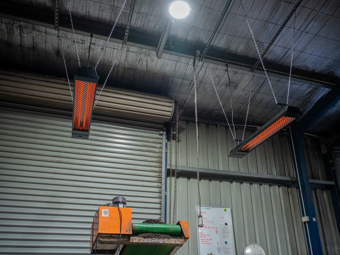 Two infrared heaters running above the potting bench at ProteaFlora