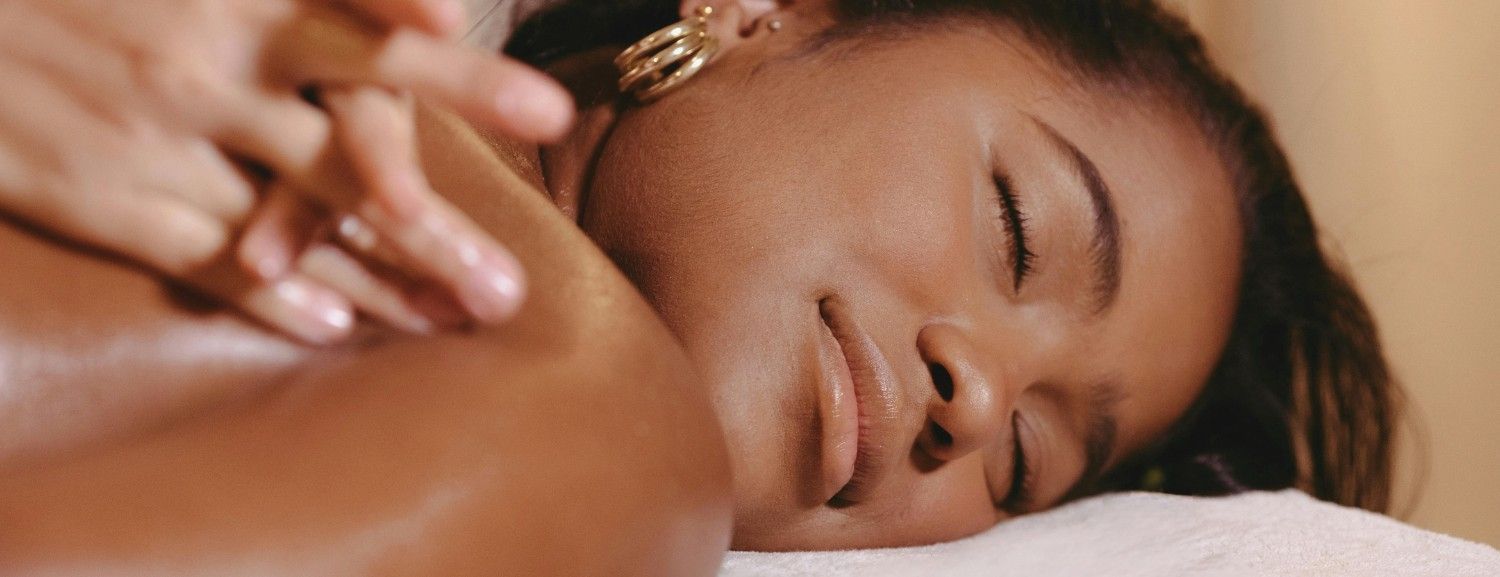 Woman relaxing during a calming Anti-Stress shoulder massage in Dubai