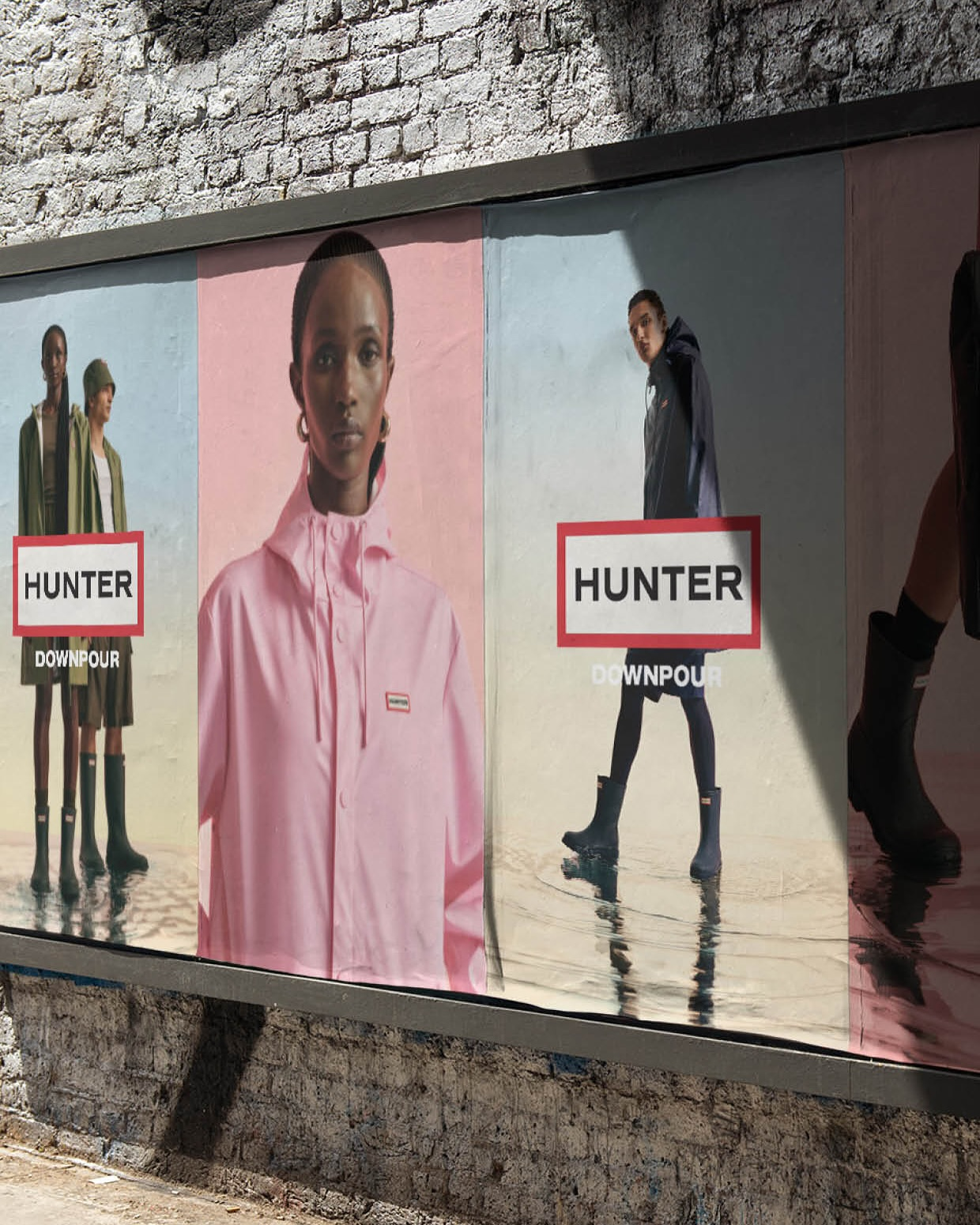 Hunter Downpour campaign collage highlighting unisex rainwear styles in neutral and pastel tones.