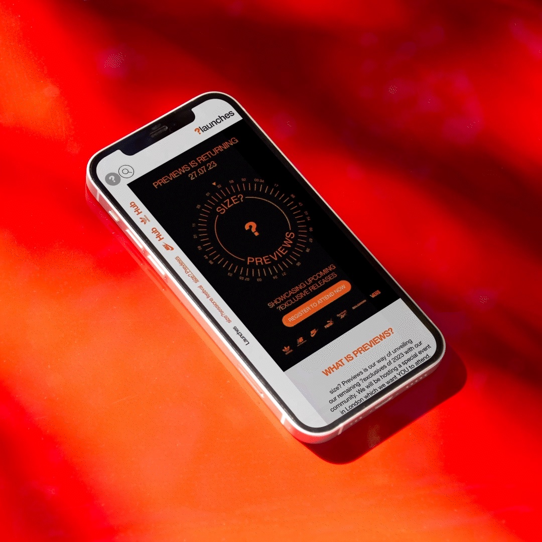 Smartphone displaying the size? previews app interface promoting exclusive sneaker releases and membership access.