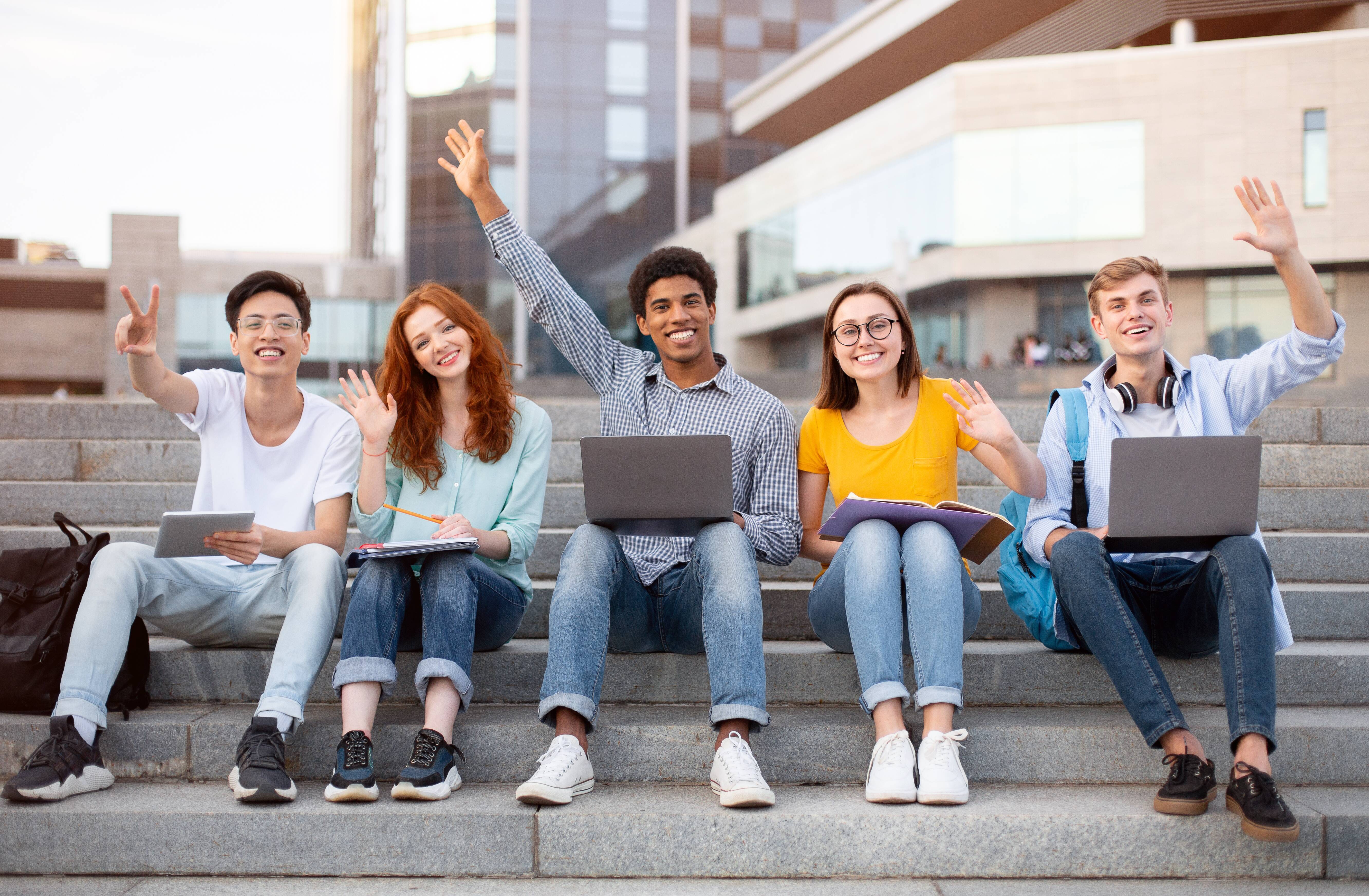 Group Of Young People Waving