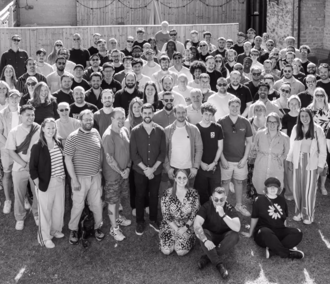 Black and white group photo of a Dexory team.