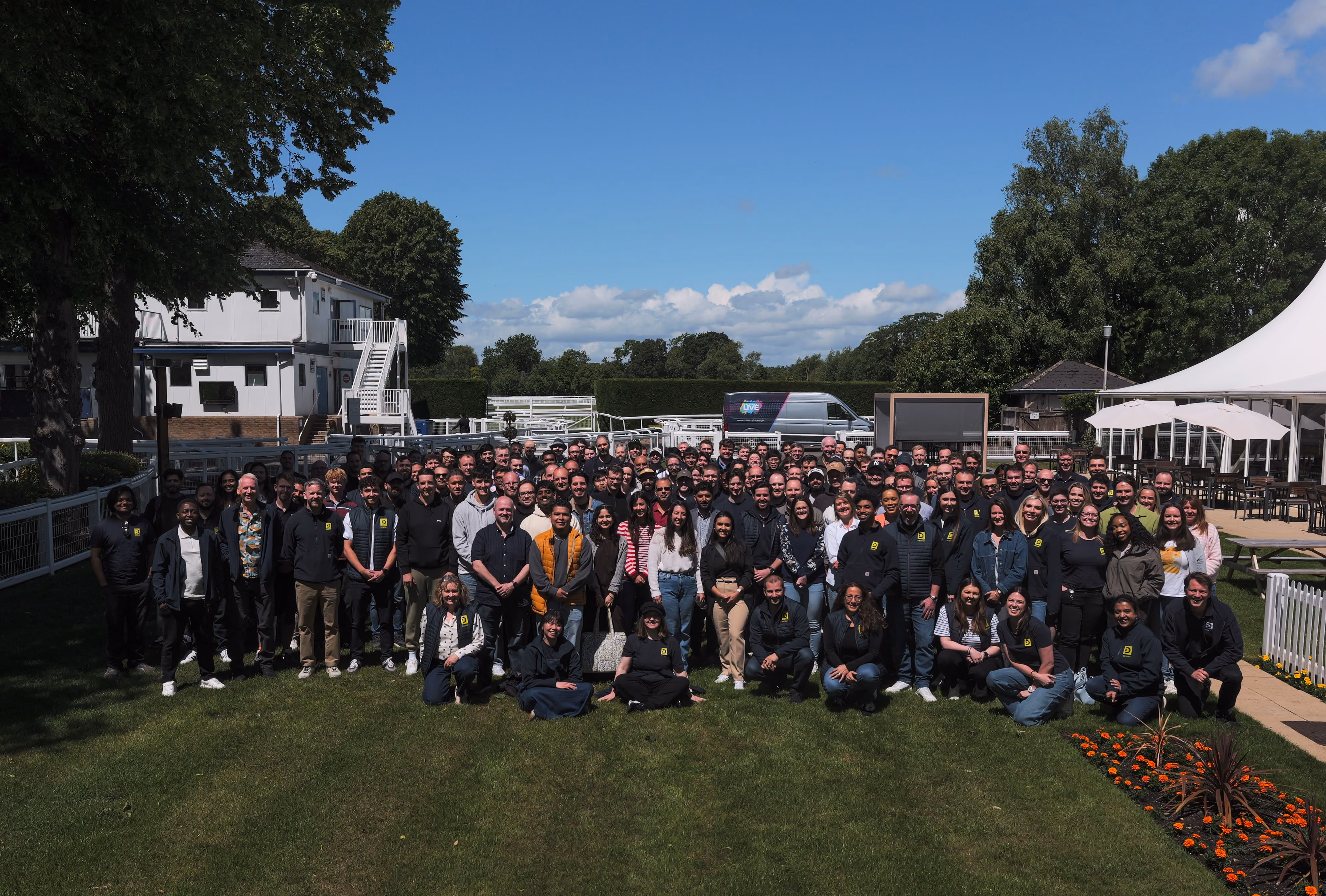 Dexory company team group photo outdoors.