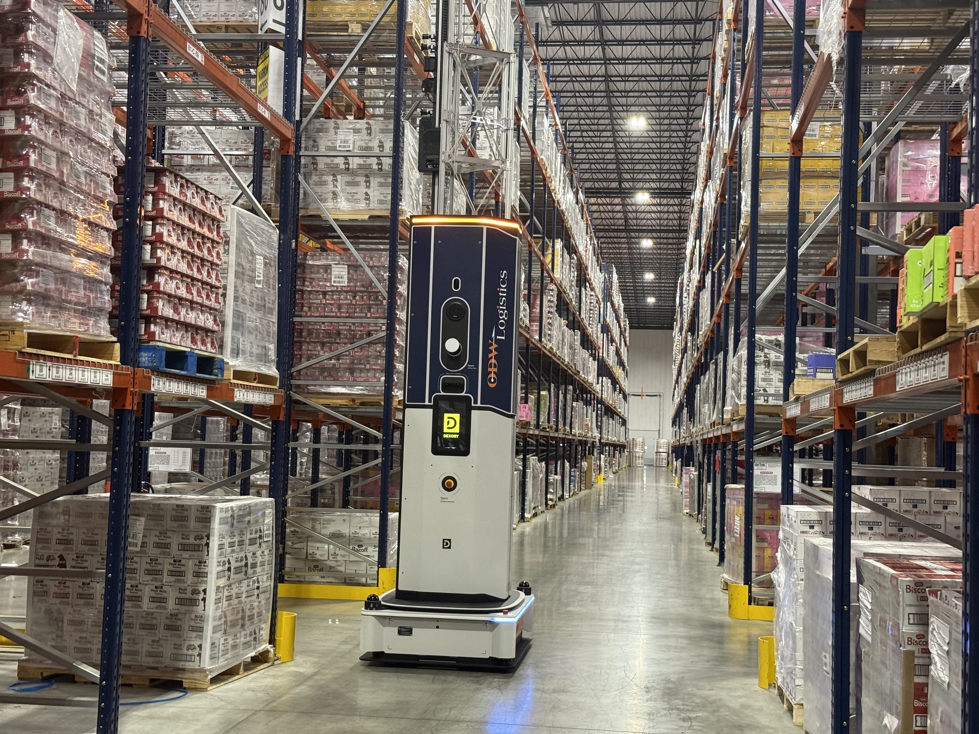 Dexory autonomous warehouse robot scanning every aisle at ODW Logistics to create a real-time digital twin, enabling continuous inventory visibility and replacing periodic manual audits with live warehouse intelligence.
