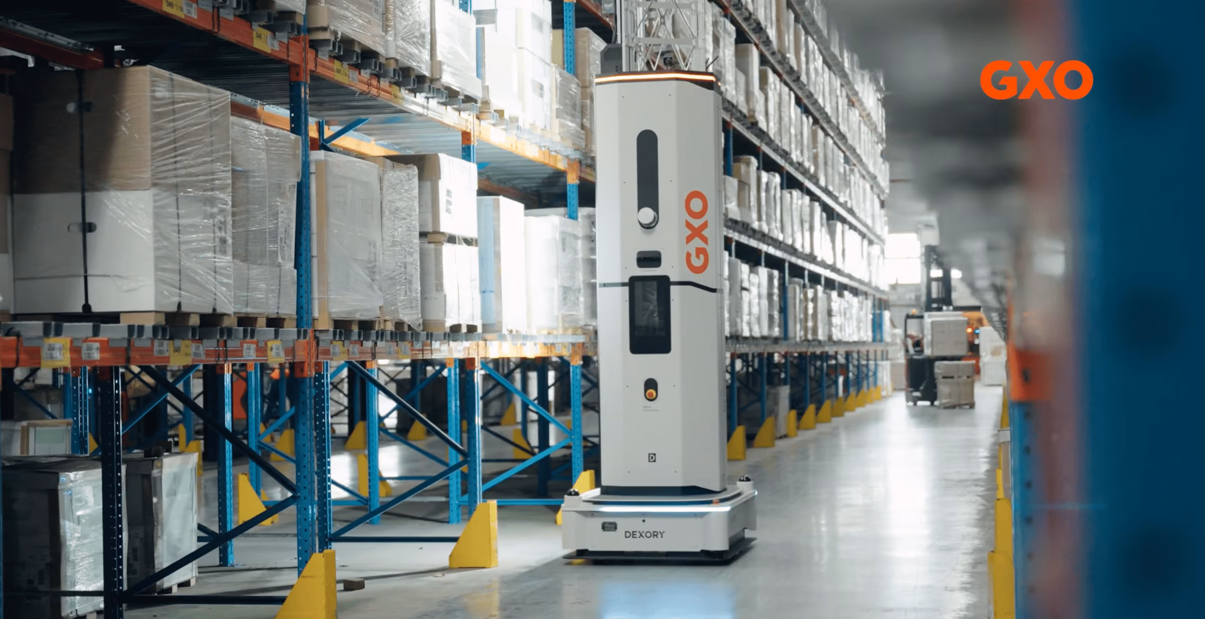 Dexory autonomous warehouse robot at GXO logistics facility, enabling the shift from reactive warehouse management to proactive real-time inventory visibility, reducing manual cycle counts and improving OTIF performance.