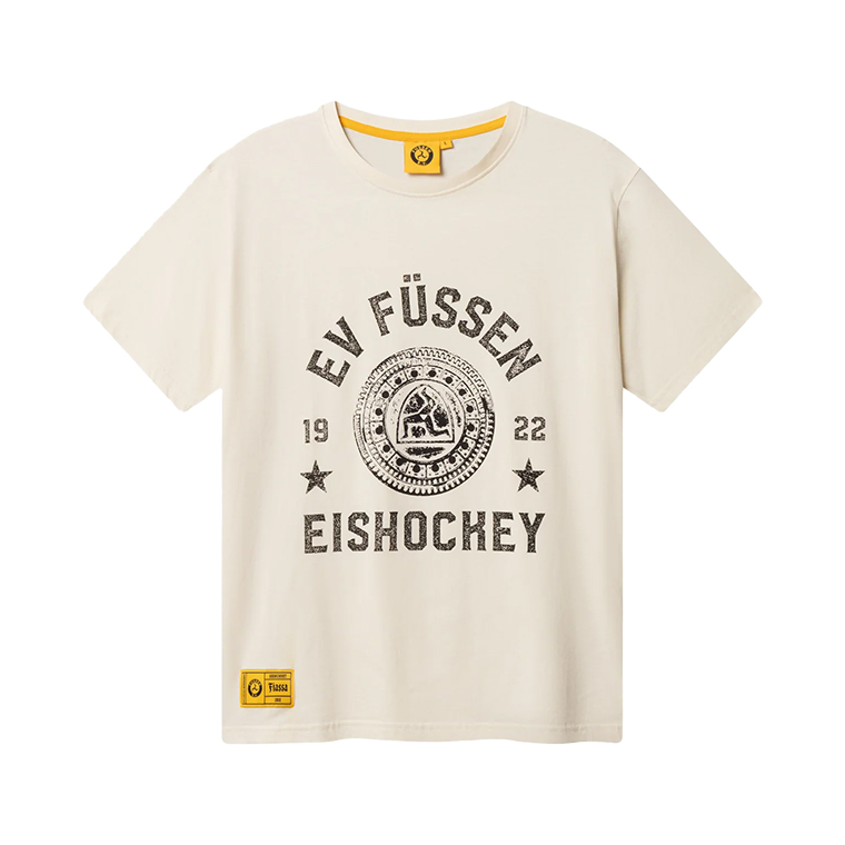 Off-white short-sleeve T-shirt with a round neck featuring black distressed text saying 'EV Füssen 1922 Eishockey' around a circular emblem and two stars, with a small yellow label near the bottom hem.