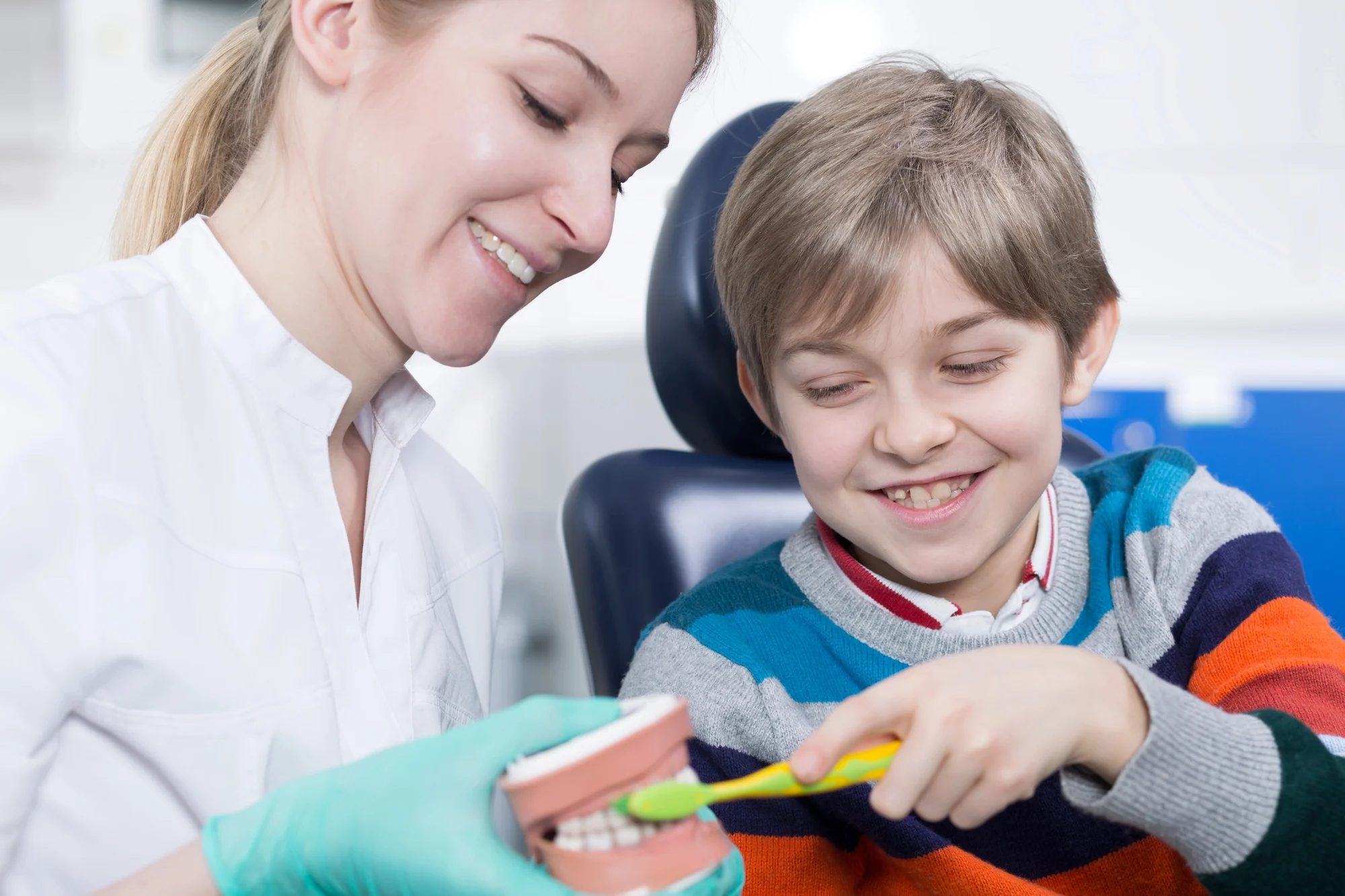 boy learning to brush teeth with pediatric dentist virginia beach