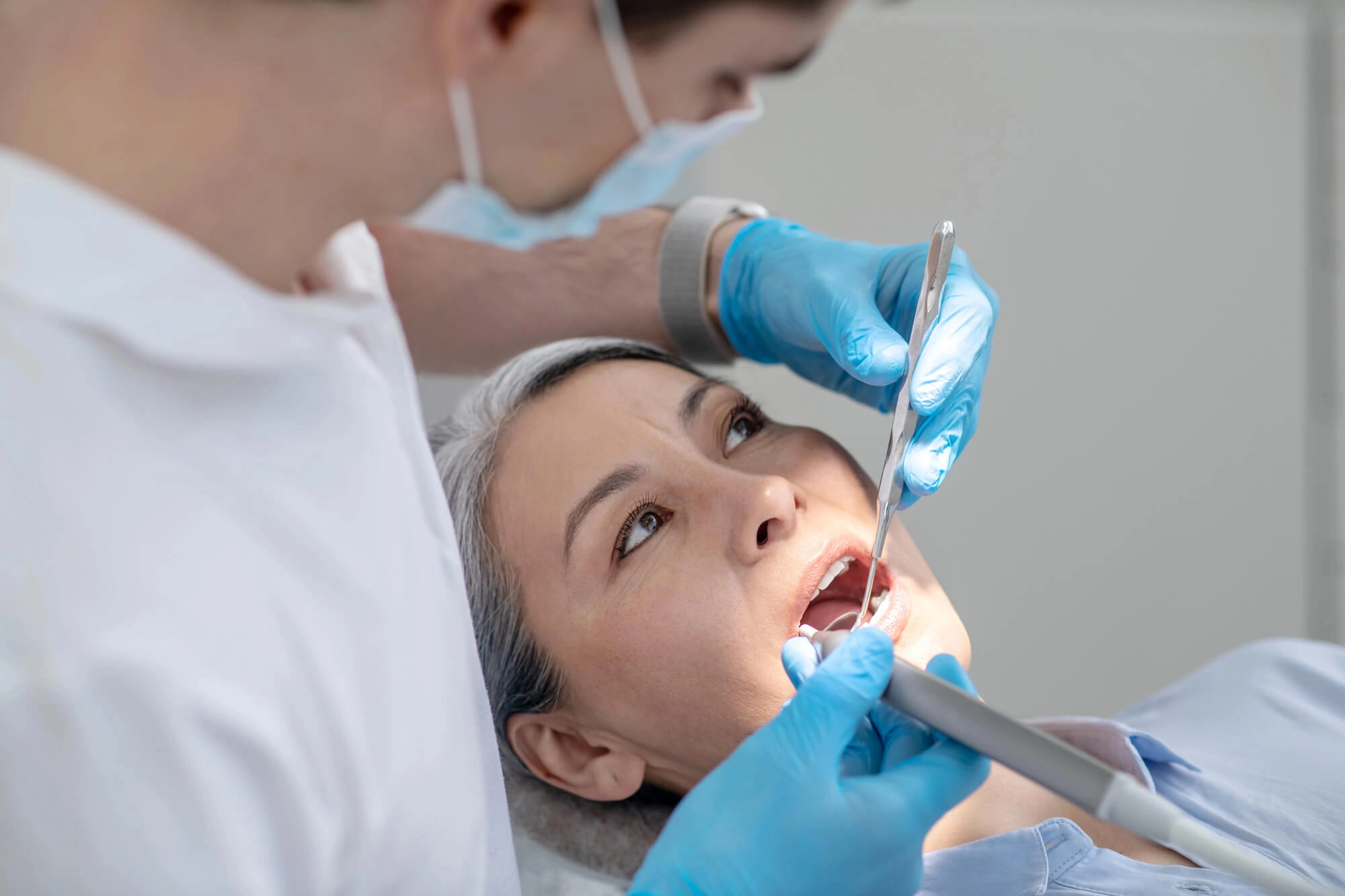 Girl undergoing dental implants by a dentist Virginia Beach