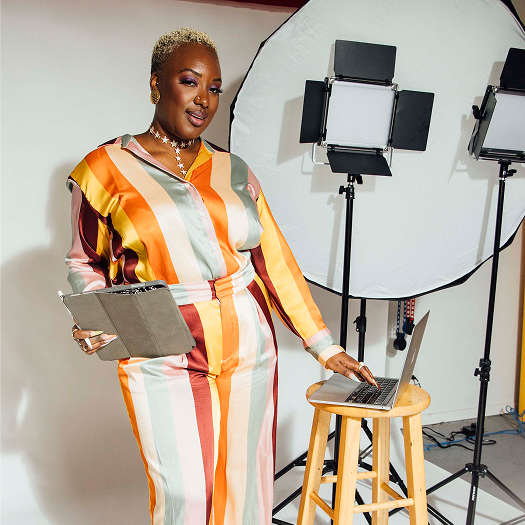 Gabriella Layne, a content creator who uses Planoly to plan, schedule, and create captions for social media posts.