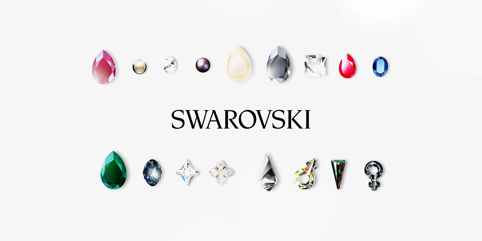 Filmproduktion Panda Pictures aus München und Ulm. Imagefilm von Swarovski. Eine Anordnung vielfältiger Swarovski Kristalle und Perlen in verschiedenen Farben und Formen auf weißem Hintergrund, eine präzise Produktpräsentation.