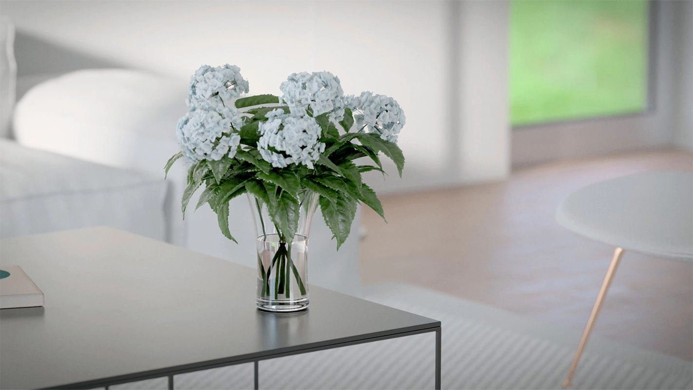 Imagefilm der Filmproduktion Panda Pictures aus München und Ulm für GIRA. Eine detaillierte Aufnahme zeigt einen stilvollen Blumenstrauß auf einem Couchtisch, im Hintergrund ist ein helles, modernes Wohnzimmer angedeutet.