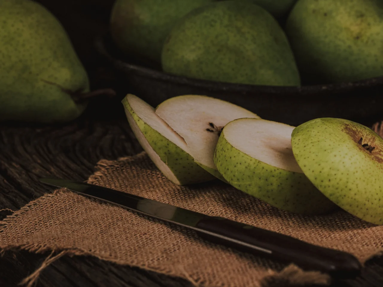 Sliced pears showing the core and seeds that should be removed before feeding a dog