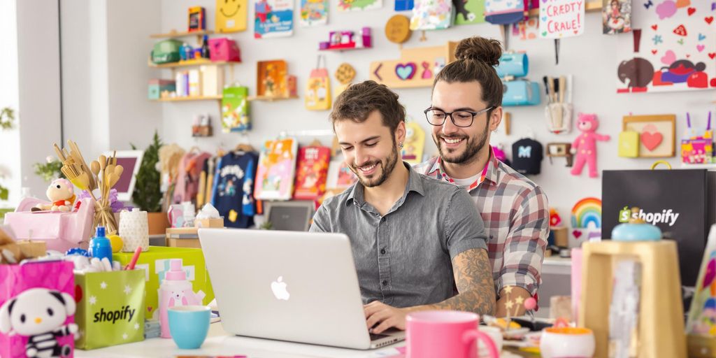 Entrepreneur working on Shopify with vibrant product display.
