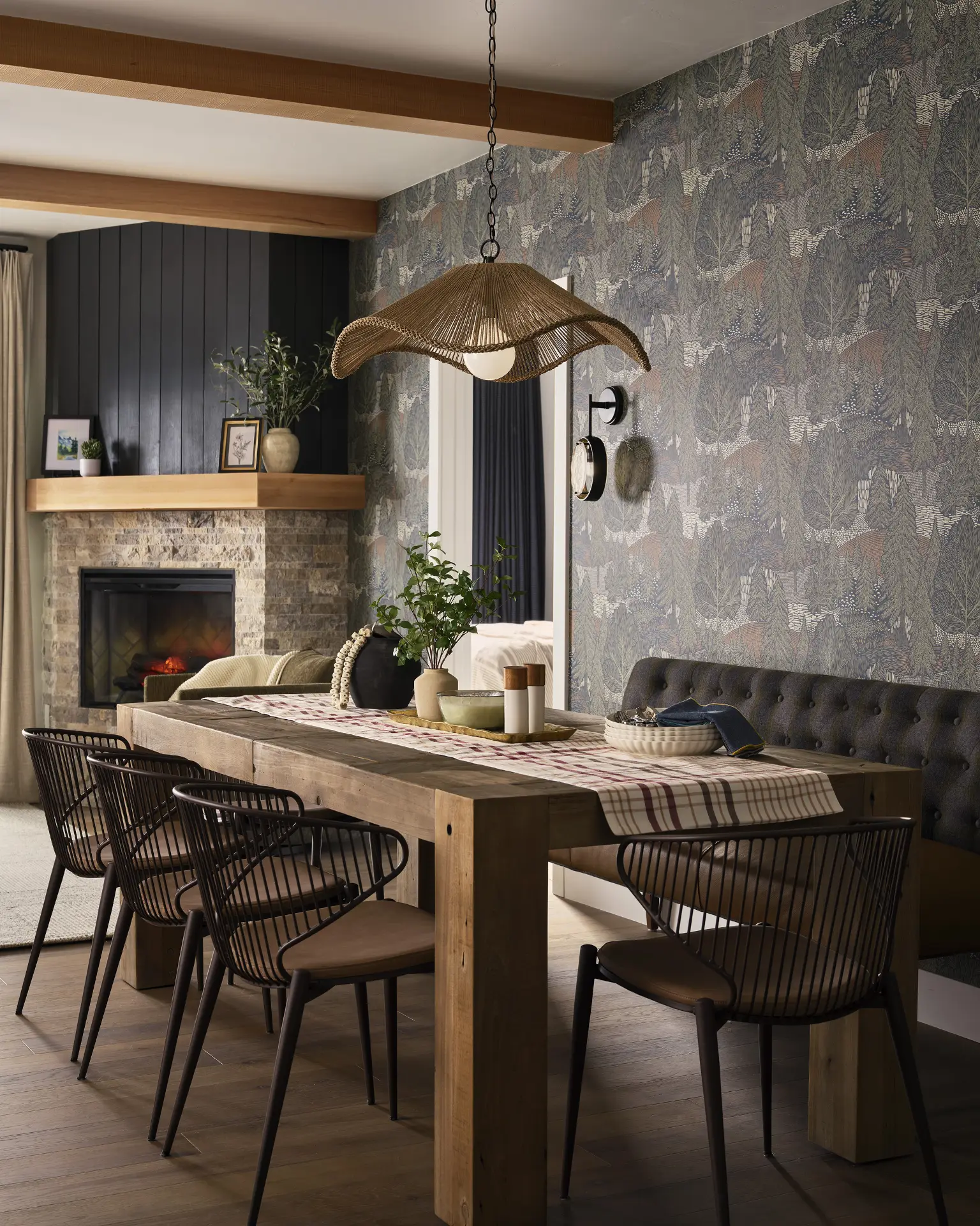 A photograph of a newly remodeled dining room to a Keystone Condo with designer furniture and lighting