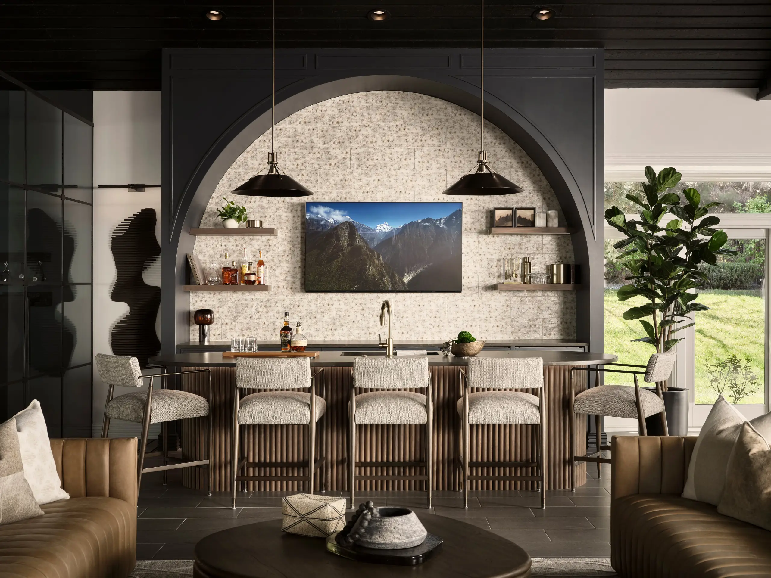 What was once an outdated pool house is now one of the most extraordinary private entertainment spaces we've ever had the privilege of designing. The Steward Project transformed a single underutilized space into a full entertainment lounge — complete with a custom bar anchored by a dramatic arch, a glass-enclosed private gym, a golf simulator, and a stunning spa-inspired bathroom. Every finish was intentional. Every detail considered. This is what bold vision and thoughtful design make possible.