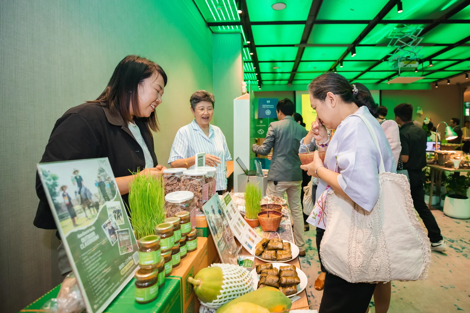 Visitors discussing food at a sustainability event