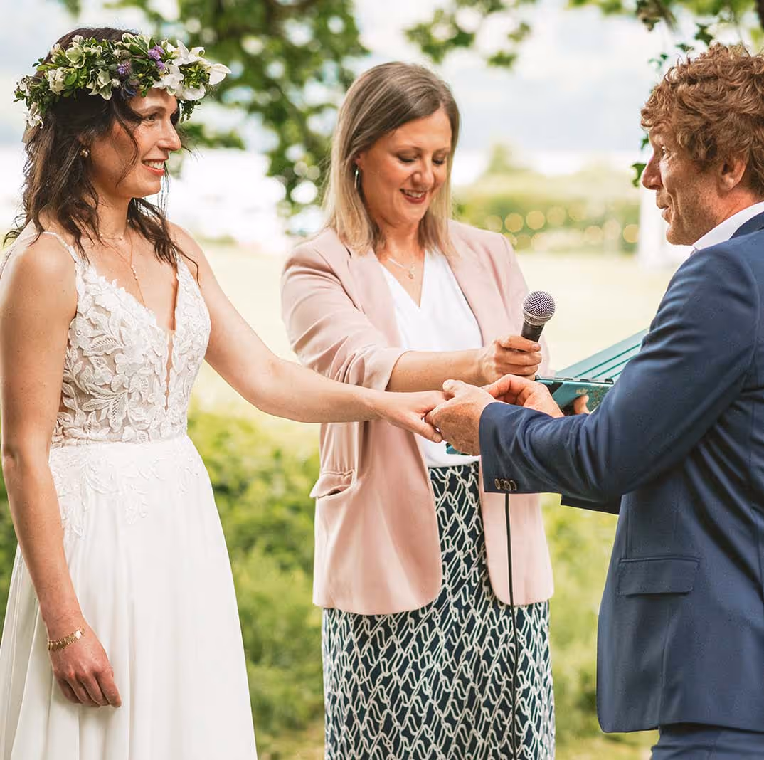 Ring exchanges in a wild woodland wedding in North Wales 