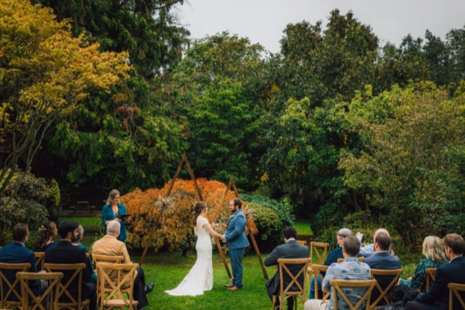 Kate Rostance wedding celebrant leading an intimate autumnal outdoor ceremony at Gwern Borter Manor in the Conwy Valley 