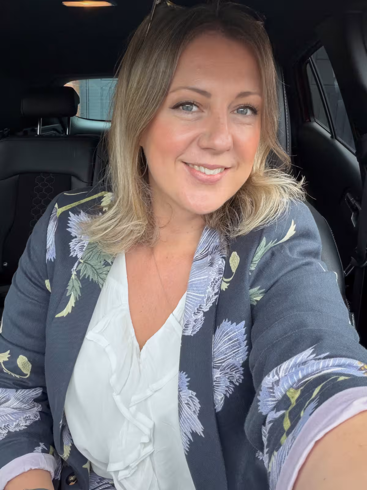 Kate Rostance, North Wales wedding celebrant, smiling before leading a ceremony at Llyn Gwynant Barns in Gwynedd