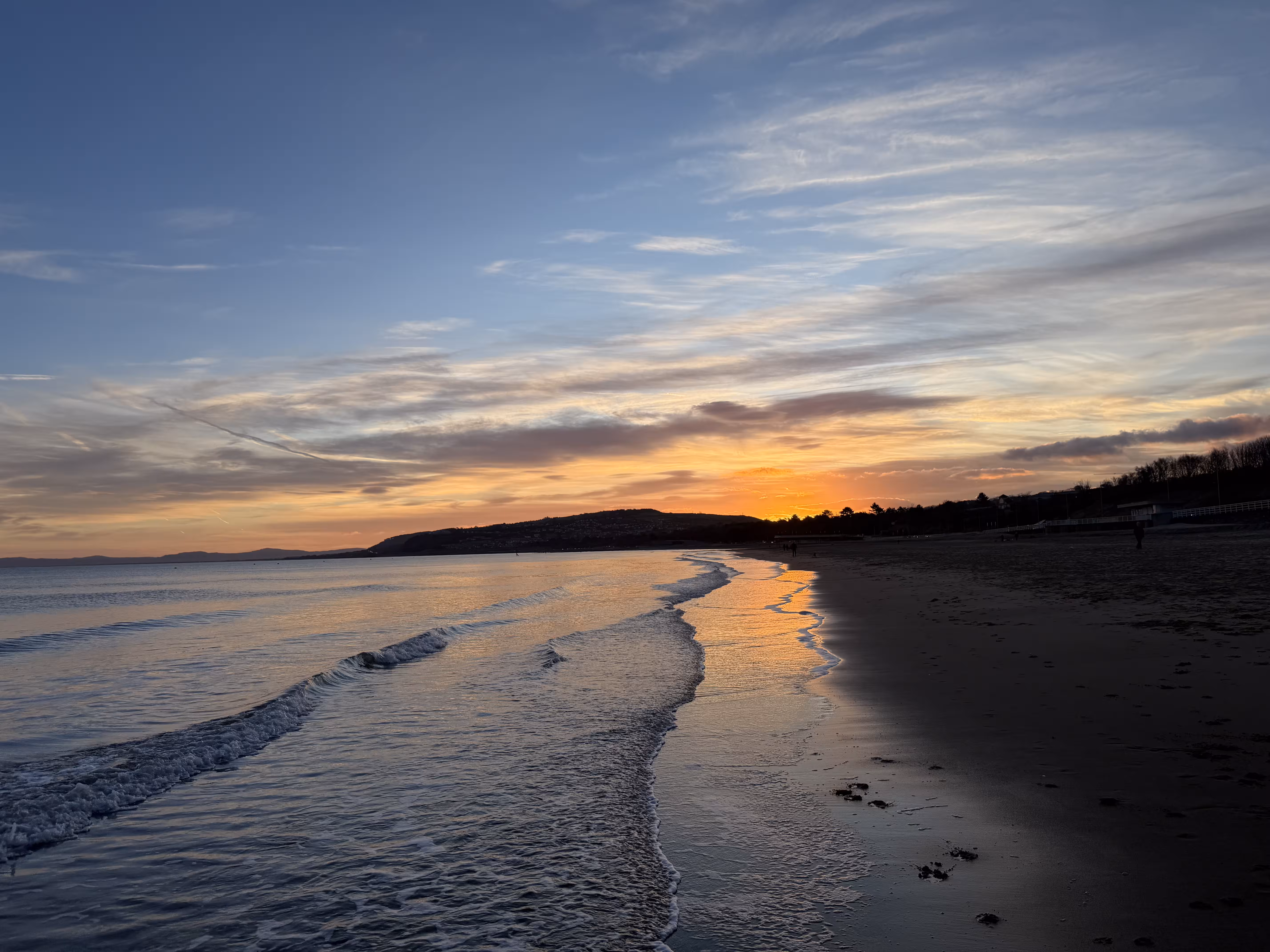 Sunrise over Colwyn Bay beach, North Wales