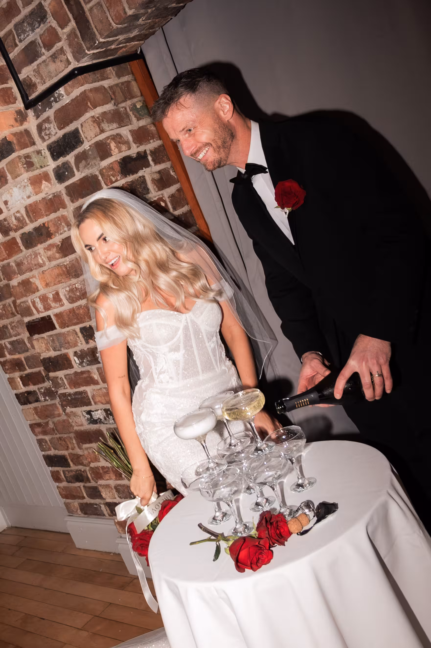 Champagne tower, bride and groom at glamorous Larkspur Lodge winter wedding