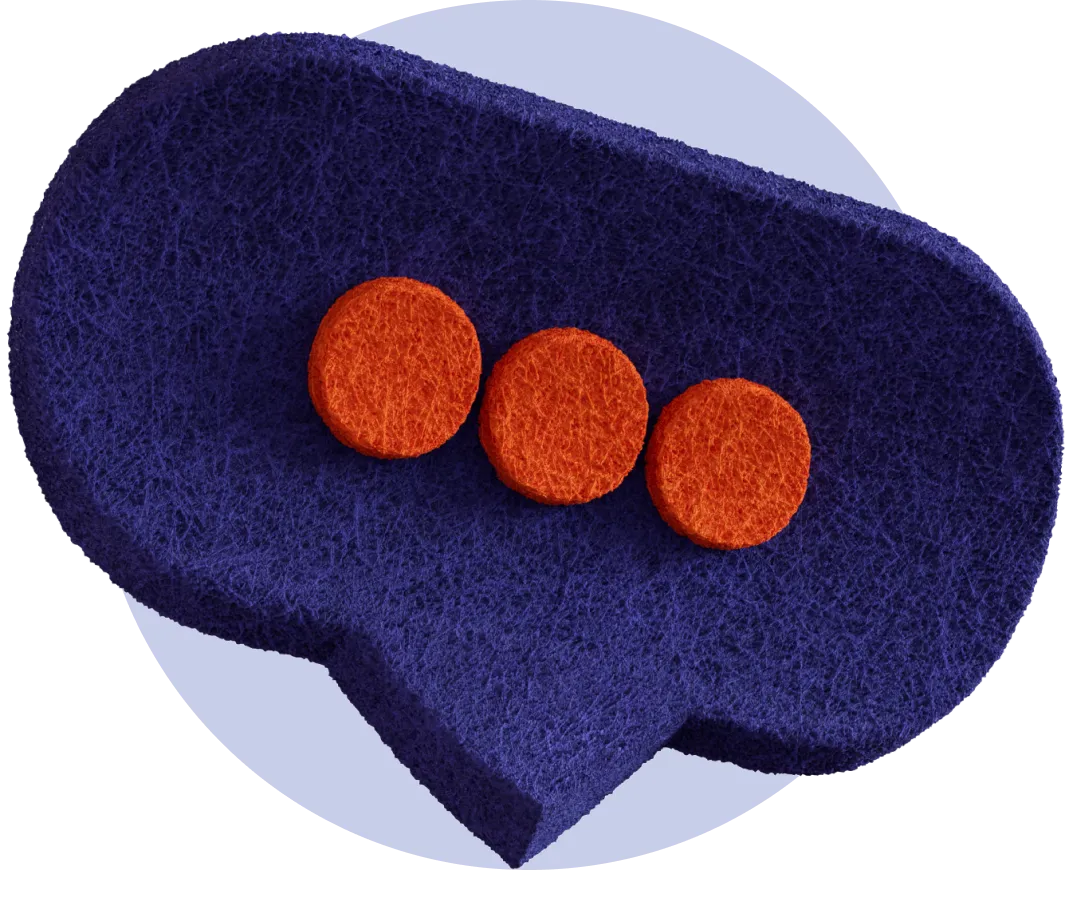 three orange buttons on a blue cloth
