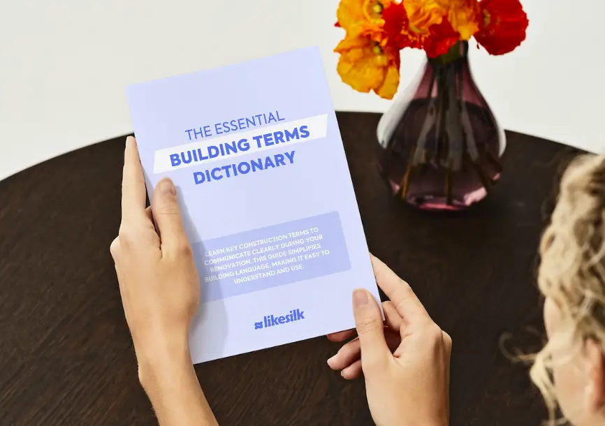 LikeSilk Building Essential Building Terms booklet being looked at by a person