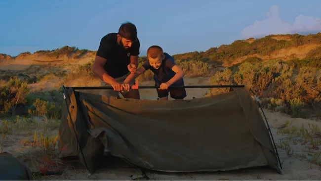 Paylos Adventure - Action shot of setting up tent