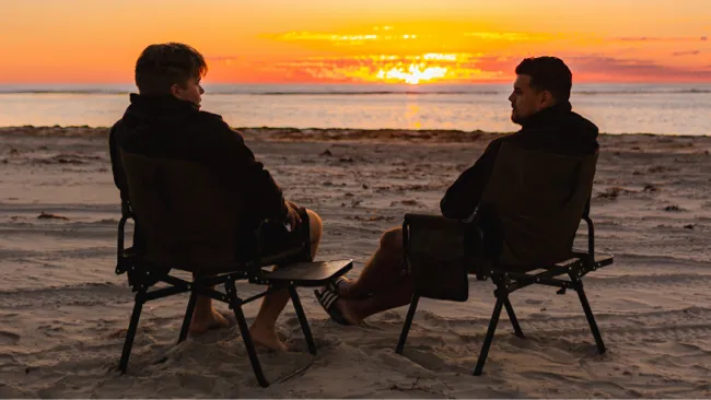 Paylos Adventure - Action shot of sitting with sunset in the background