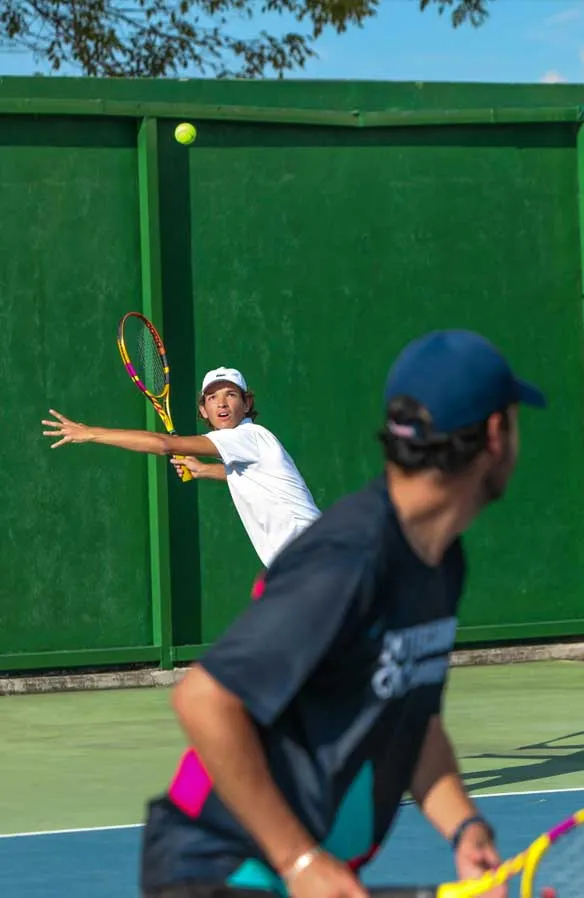 Two tennis players engaged in a match.