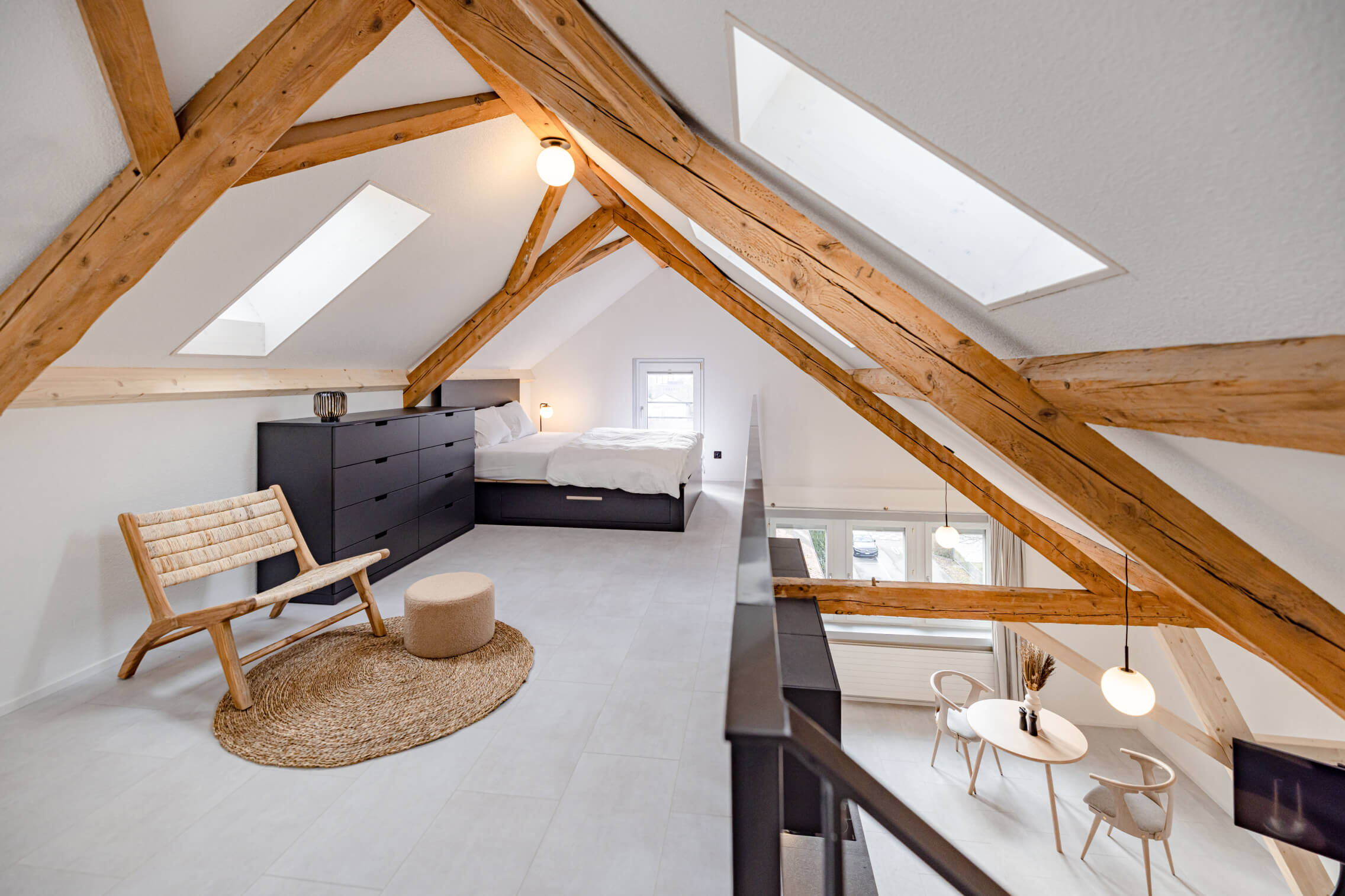 Private Apartments – attic bedroom with exposed timber trusses