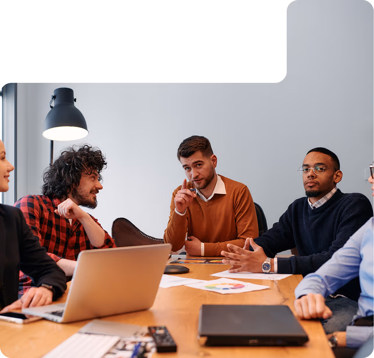 a few people discussing in a room