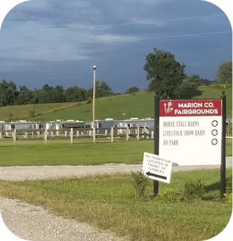 A sign displaying the words Marion Co Fairgrounds