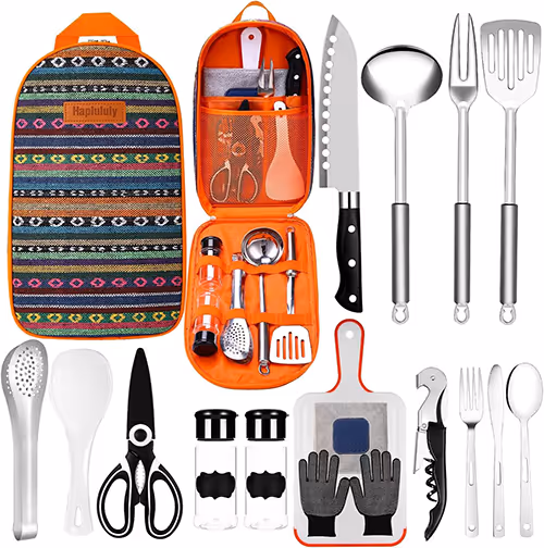 A collection of kitchen utensils featuring a knife, spatula, scissors, and a bag arranged neatly on a countertop.