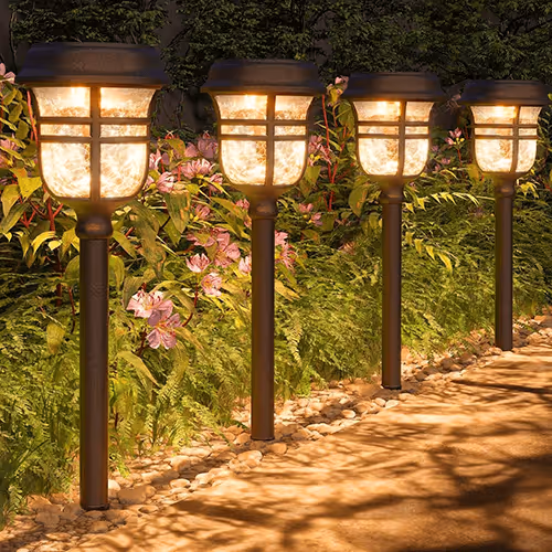 Solar garden lights line a winding stone path