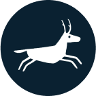 A white silhouette of a deer or antelope in mid-stride, set against a solid dark blue circular background.