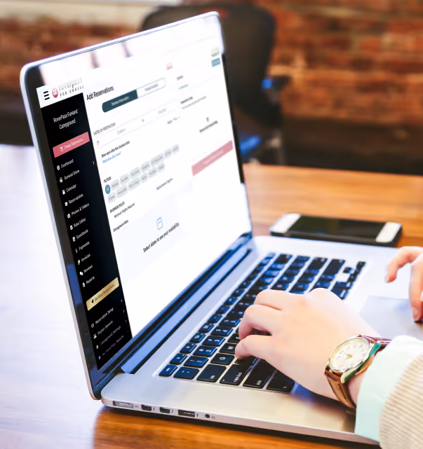 Laptop showing campground owner add a reservation